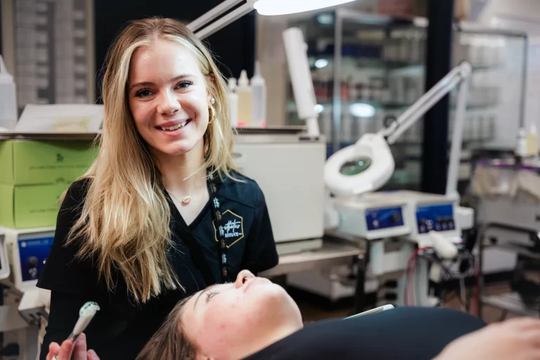 Student smiling while doing brow service