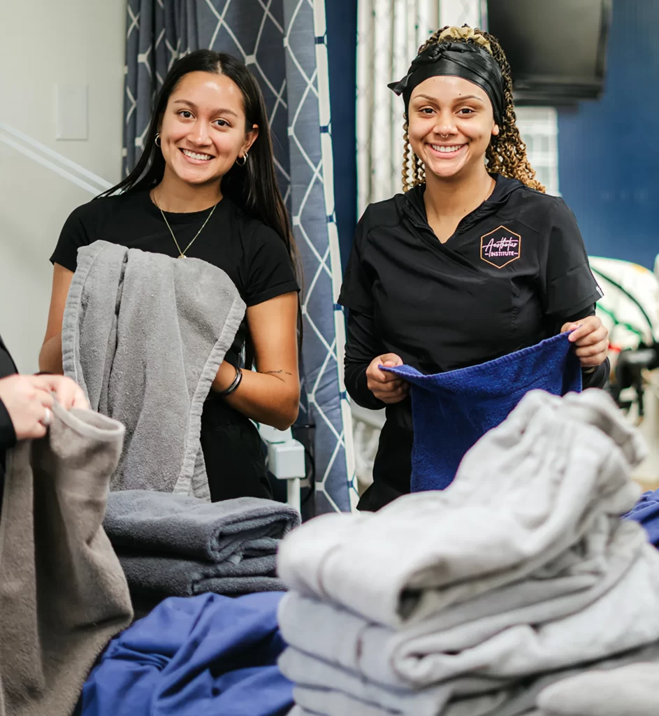 Students folding laundry