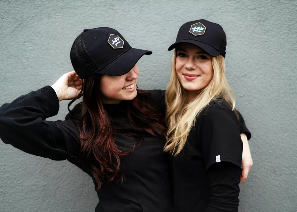 Two students in black hats